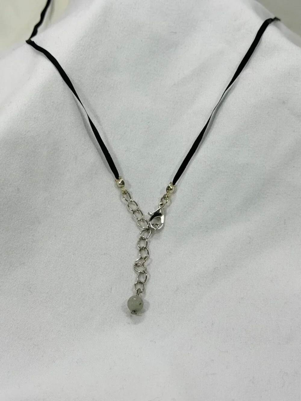 Elegant Silver and Black Necklace with an earthy colored bead